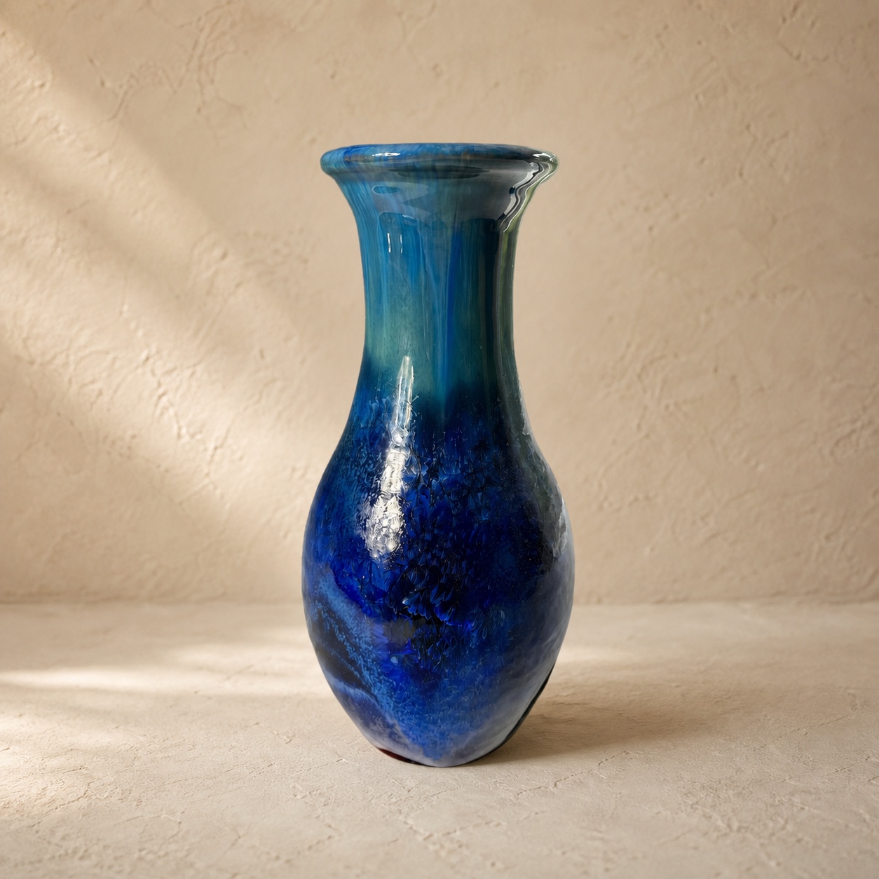 Slender blue crystalline-glazed bottle with a flared rim by Mark Barta