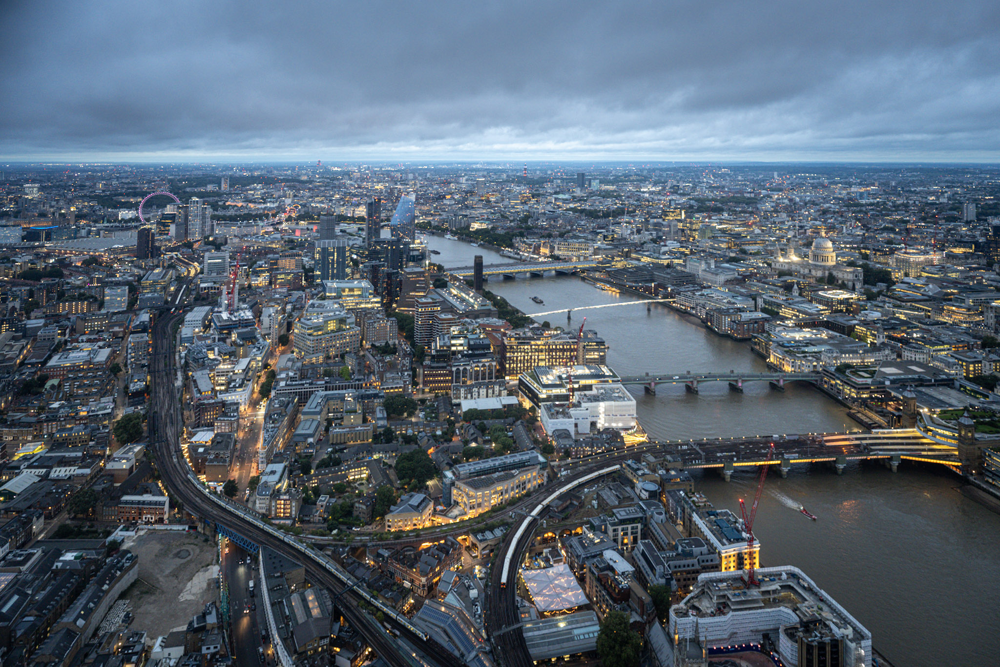Wide elevated view from The Shard across central London with the River Thames and several bridges